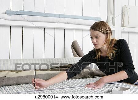 Woman measuring fabric View Large Photo Image Picture - Woman measuring fabric. Fotosearch
