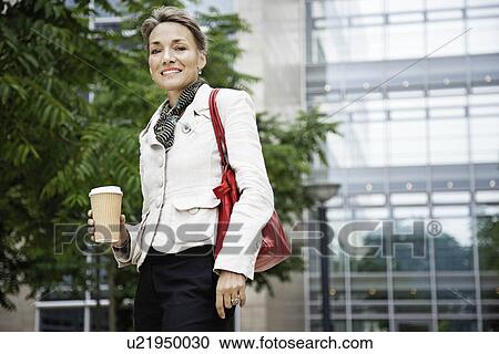 Stock Image - Woman on coffee break. Fotosearch