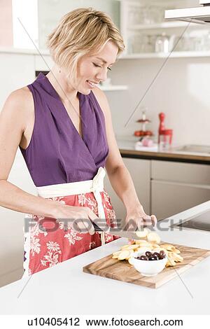 Woman preparing food View Large Photo Image Stock Image - Woman preparing food. Fotosearch