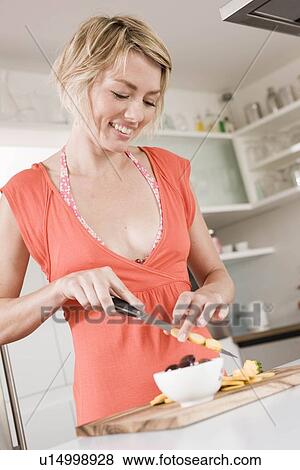 Stock Photo - Woman preparing food. Fotosearch