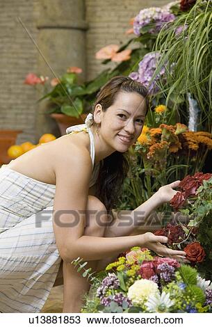 Woman shopping in a flower shop View Large Photo Image Stock Image - Woman shopping in a flower shop. Fotosearch