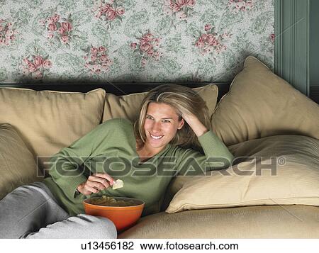 Woman watching television View Large Photo Image Stock Image - Woman watching television. Fotosearch