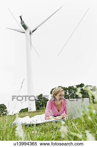 Stock Photography - Woman working on a laptop computer. Fotosearch