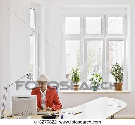 Woman working on computer View Large Photo Image Stock Image - Woman working on computer. Fotosearch