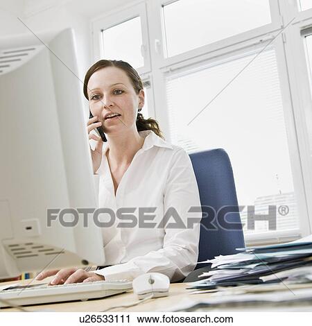 Woman working on computer View Large Photo Image Stock Image - Woman working on computer. Fotosearch
