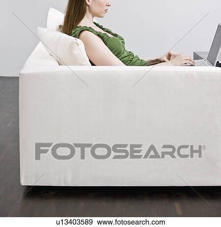 Woman working on laptop computer View Large Photo Image Stock Photo - Woman working on laptop computer. Fotosearch