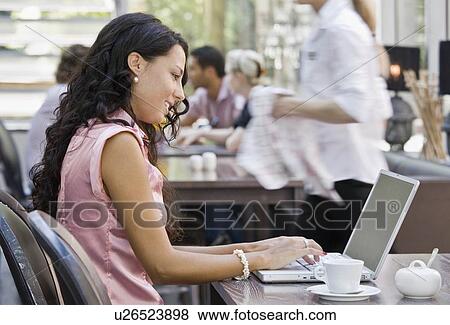 Woman working on laptop computer View Large Photo Image Stock Photo - Woman working on laptop computer. Fotosearch