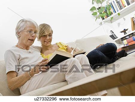 Women and young girl reading View Large Photo Image Stock Photograph - Women and young girl reading. Fotosearch