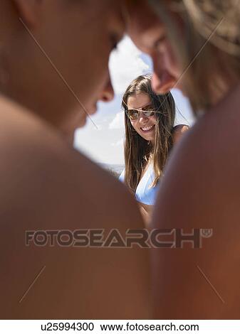 Stock Image - Women gossiping. Fotosearch