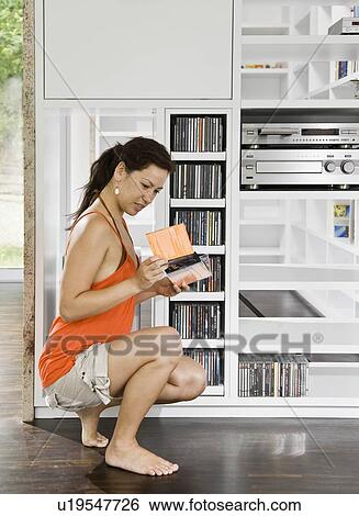 Women looking over CDs View Large Photo Image Stock Photograph - Women looking over CDs. Fotosearch