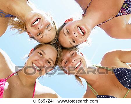 Women smiling, shot from low angle View Large Photo Image Stock Image - Women smiling, shot from low angle. Fotosearch