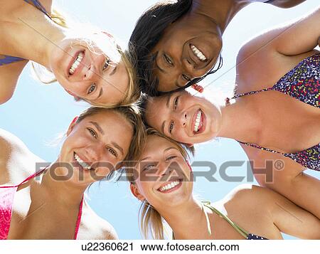 Women smiling, shot from low angle View Large Photo Image Stock Image - Women smiling, shot from low angle. Fotosearch