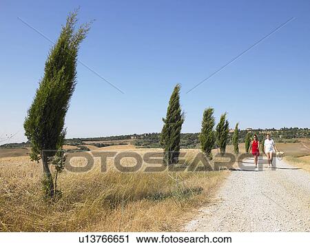 Stock Image - Women walking in countryside. Fotosearch