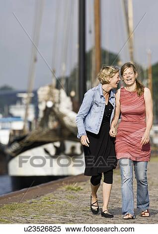 Stock Photography - Women walking on a pier. Fotosearch