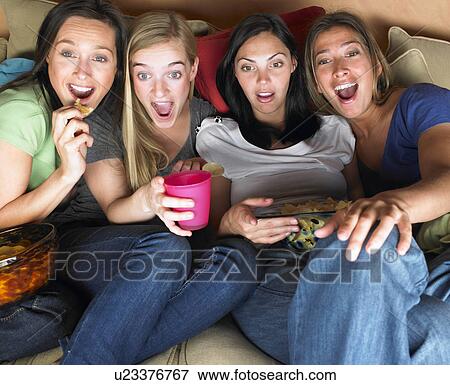 Stock Photo - Women watching television. Fotosearch