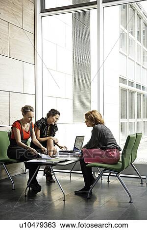 Women working on a project View Large Photo Image Stock Image - Women working on a project. Fotosearch