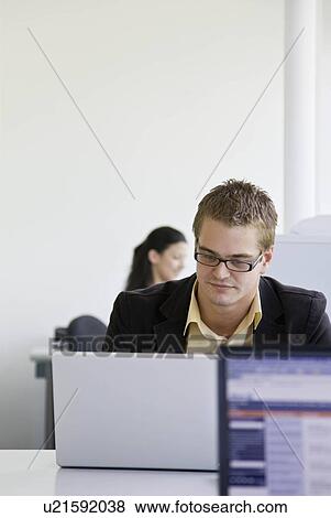 Workers in busy office View Large Photo Image Stock Photo - Workers in busy office. Fotosearch