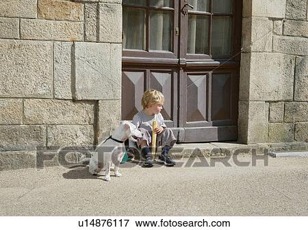 Stock Photo - Young boy with dog. Fotosearch