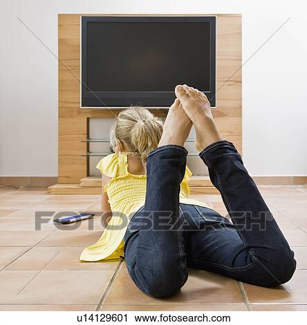 Young girl watching television View Large Photo Image Stock Image - Young girl watching television. Fotosearch