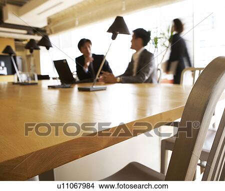 Picture - Businesspeople in Conference Room, Focus on Foreground. Fotosearch