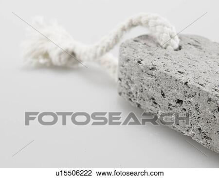 Stock Image - Close-Up of Pumice Stone on String. Fotosearch