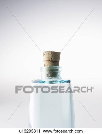 Stock Image - Close-Up of Single Glass Bottle with Cork. Fotosearch