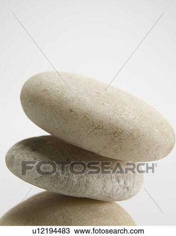 Stock Image - Close-Up of Three Stones on Top of Each Other. Fotosearch