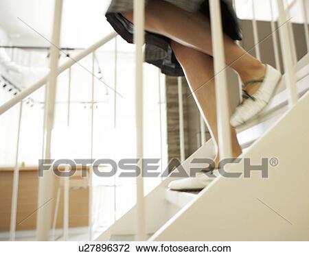 Close-Up of Woman Walking Down Steps View Large Photo Image Stock Image - Close-Up of Woman Walking Down Steps. Fotosearch