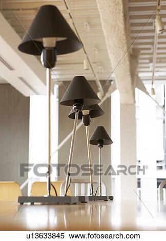 Stock Photography - Low Angle View of Desk Lamps. Fotosearch