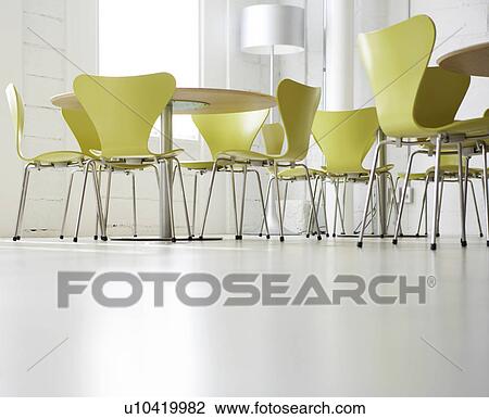 Stock Image - Low Angle View of Tables and Chairs. Fotosearch