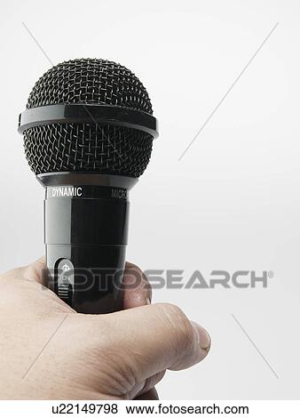 Person Holding Microphone View Large Photo Image Stock Photo - Person Holding Microphone. Fotosearch