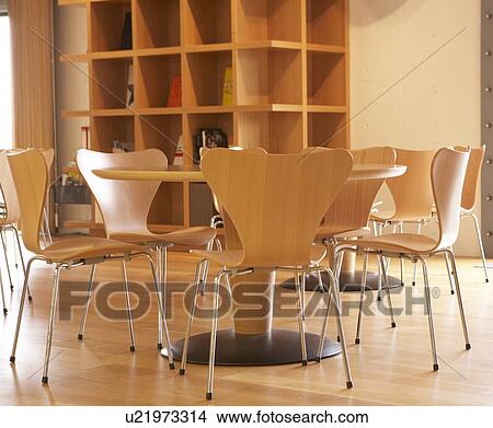 Tables and Chairs Near Bookshelf View Large Photo Image Picture - Tables and Chairs Near Bookshelf. Fotosearch