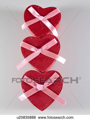 Stock Photo - Three Heart Shaped Gift Boxes. Fotosearch