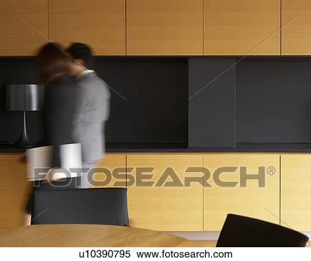 Two Businesspeople Walking in Kitchen View Large Photo Image Stock Photography - Two Businesspeople Walking in Kitchen. Fotosearch