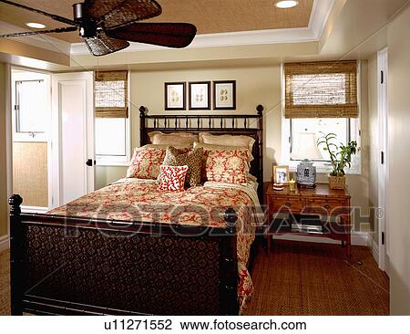 Stock Image - Bedroom with ceiling fan. Fotosearch
