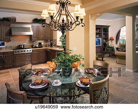 Stock Photo - Circular dining table in traditional kitchen. Fotosearch
