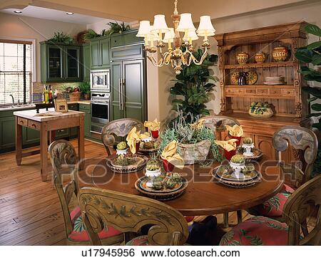 Stock Photograph - Circular dining table in traditional kitchen. Fotosearch
