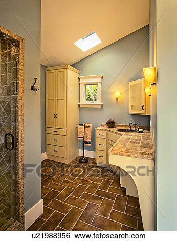 Stock Photograph - Contemporary bathroom with pitched ceiling. Fotosearch