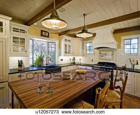 Stock Image - Contemporary kitchen in Spanish style home. Fotosearch