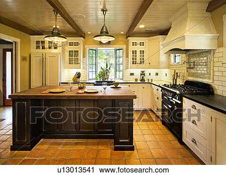 Contemporary kitchen in spanish style home View Large Photo Image Stock Image - Contemporary kitchen in spanish style home. Fotosearch