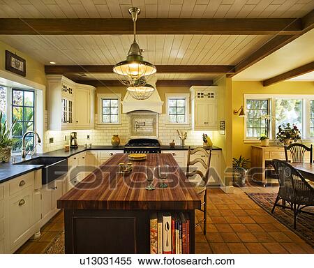 Stock Photography - Contemporary kitchen in spanish style home. Fotosearch