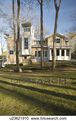 Stock Image - Contemporary multiple story shingle style house. Fotosearch