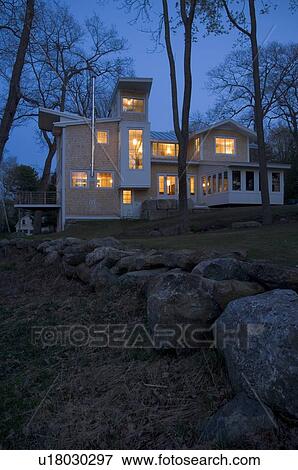 Contemporary shingle style home at dusk View Large Photo Image Stock Photo - Contemporary shingle style home at dusk. Fotosearch