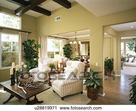 Stock Image - Cozy sitting area with striped arm chairs. Fotosearch