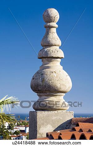 Stock Photo - Detail concrete ornamentation and red roof tiles. Fotosearch