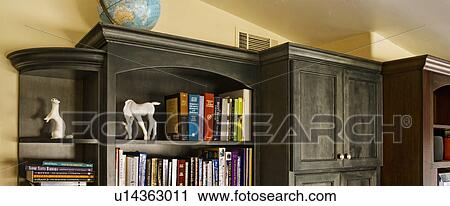 Stock Image - Detail custom bookcase and cabinets. Fotosearch