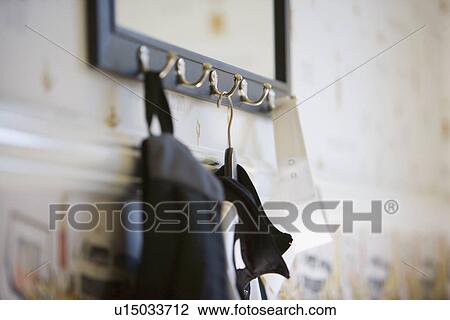 Stock Image - Detail hanger hanging on hook. Fotosearch