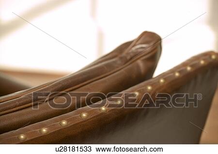 Detail on brown leather chair View Large Photo Image Stock Image - Detail on brown leather chair. Fotosearch