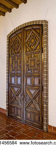 Picture - Detail ornate wooden double doors, panoramic. Fotosearch