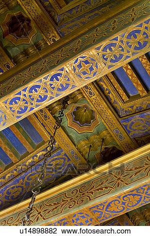 Stock Image - Detail ornately painted ceiling beams. Fotosearch